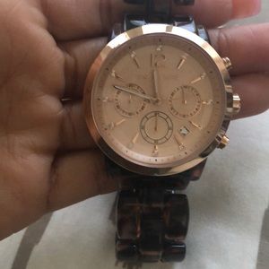 Authentic rose gold Michael Kors women watch.